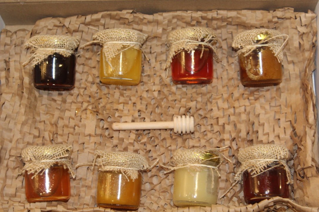 The 8 jars of different honey for sale including spanish honey,bulgarian honey,aniseed honey,strawberry honey,rapessed honey, ssunflower honey, lime honey and Loquat honey, the best collection with the best flavours all included in one box with an extra hooneydipper.