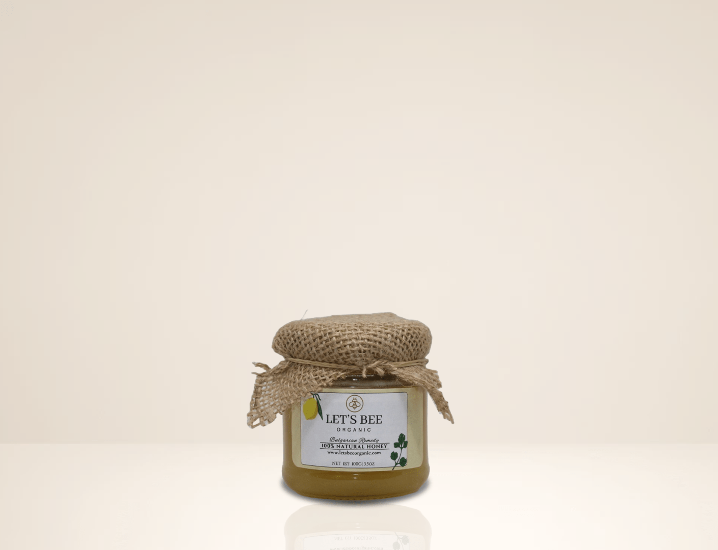 100G jar of Organic bulgarian honey with it's sticker and the piece of textil on top, honey to  buy, and honey for sale.